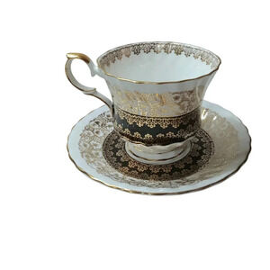 Queen Anne Black and Gold Drapery Tea Cup and Saucer England Bone China